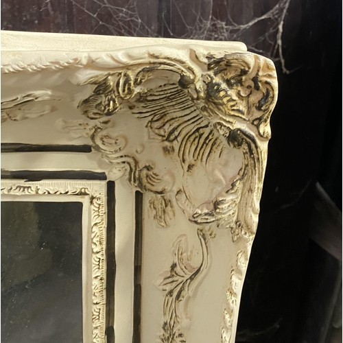 181 - A RECTANGULAR ALABASTER MIRROR, finely decorated with floral scrolling decoration as well as cherubs... 