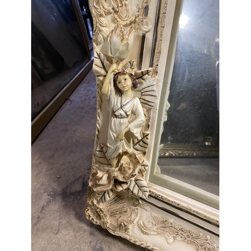 181 - A RECTANGULAR ALABASTER MIRROR, finely decorated with floral scrolling decoration as well as cherubs... 