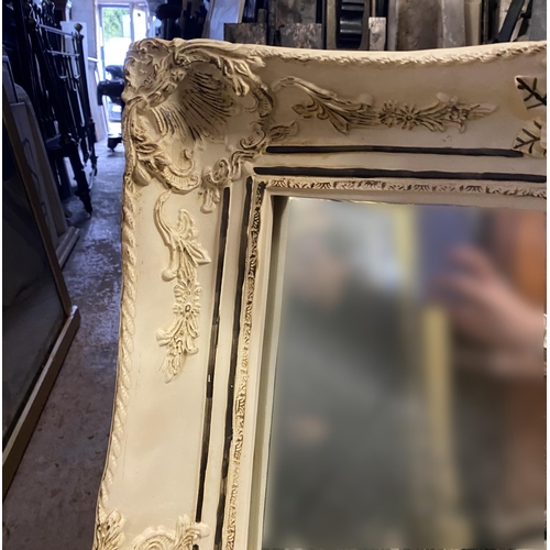 181 - A RECTANGULAR ALABASTER MIRROR, finely decorated with floral scrolling decoration as well as cherubs... 