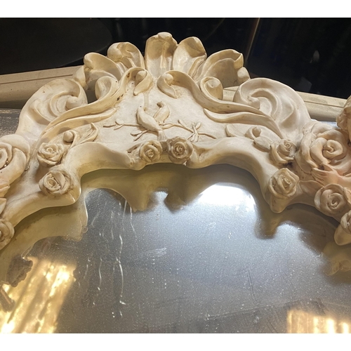 182 - A BEAUTIFUL ALABASTER CHERUB WALL MIRROR, crest form with floral rose decoration throughout, scroll ... 