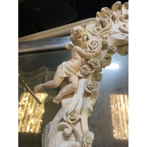 182 - A BEAUTIFUL ALABASTER CHERUB WALL MIRROR, crest form with floral rose decoration throughout, scroll ... 