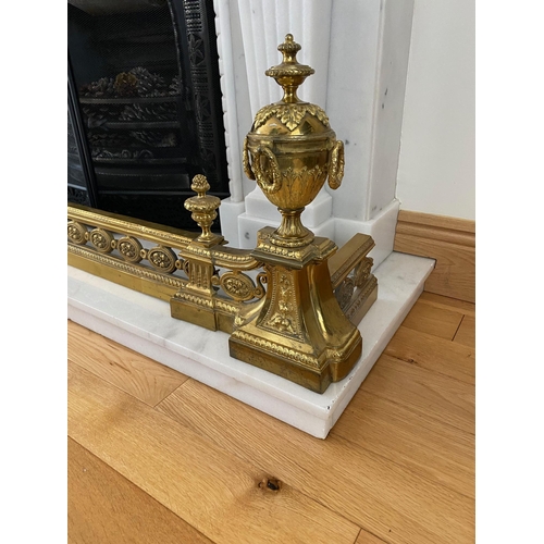 185 - AN ADJUSTABLE DECORATIVE FIRE FENDER with raised urn style ends, highly decorative with scrolling fo... 