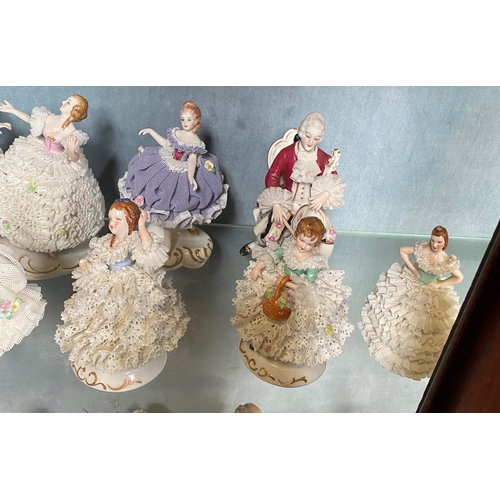 191 - A COLLECTION OF IRISH DRESDEN FIGURINES – 12 pieces included in this lot. Beautiful delicate crafted... 