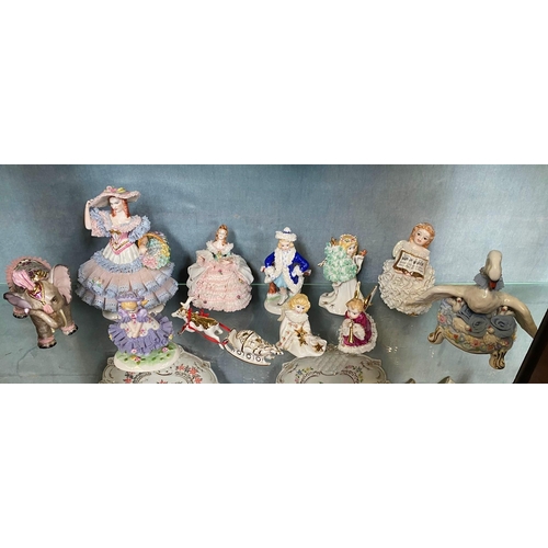 192 - A COLLECTION OF IRISH DRESDEN FIGURINES – 11 pieces included in this lot. Beautiful delicate crafted... 