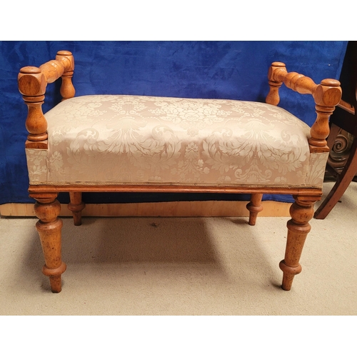 197 - A VERY GOOD IRISH WOOD TURNED WINDOW SEAT with upholstered padded seat. Raised supports on each corn... 