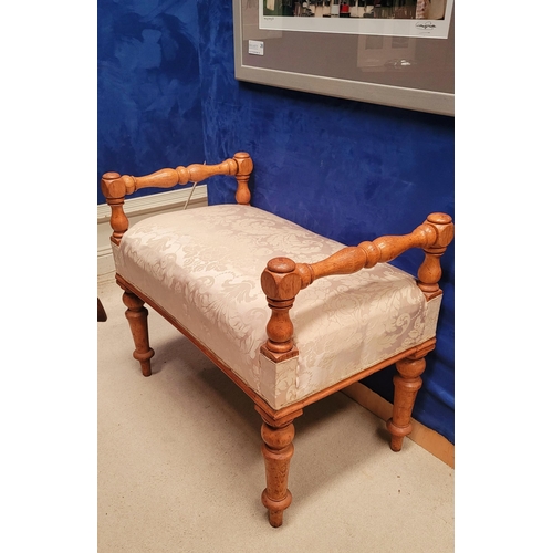 197 - A VERY GOOD IRISH WOOD TURNED WINDOW SEAT with upholstered padded seat. Raised supports on each corn... 