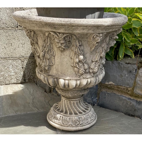 200 - A PAIR OF VERY GOOD QUALITY STONE GARDEN PLANTER URNS, with foliage, fruit & faun like head motif to... 