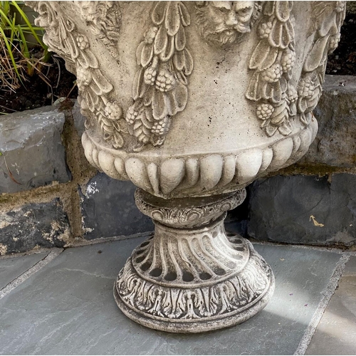 200 - A PAIR OF VERY GOOD QUALITY STONE GARDEN PLANTER URNS, with foliage, fruit & faun like head motif to... 