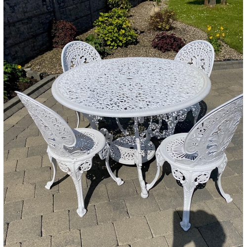 210 - A GOOD QUALITY CAST ALLOY GARDEN SUITE; including a circular table with scrolling legs having a circ... 