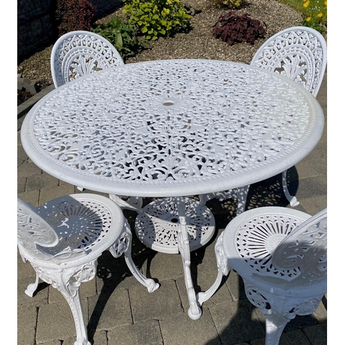 210 - A GOOD QUALITY CAST ALLOY GARDEN SUITE; including a circular table with scrolling legs having a circ... 