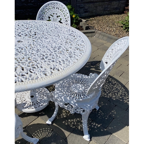 210 - A GOOD QUALITY CAST ALLOY GARDEN SUITE; including a circular table with scrolling legs having a circ... 