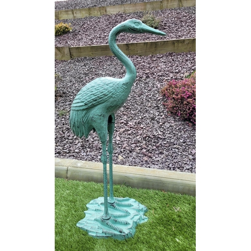 217 - A PAIR OF GARDEN ORNAMENTS IN THE FORM OF TWO HERON BIRDS, one standing upright the second with its ... 