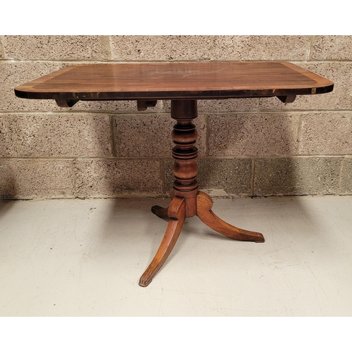 218 - A 19TH CENTURY TIP-UP CROSS-BANDED MAHOGANY OCCASSIONAL TABLE, rectangular in shape; the edge of the... 