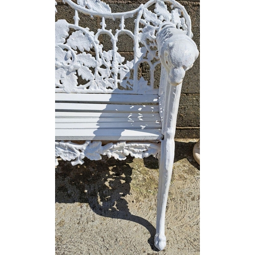 239 - A VERY GOOD QUALITY CAST IRON GARDEN BENCH, decorated with scrolling oak leaf decoration to the shap... 