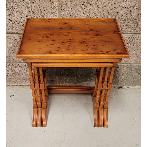 29 - A GOOD EARLY 20TH CENTURY NEST OF THREE YEW WOOD TABLES, each with a slightly raised edge to the tab... 