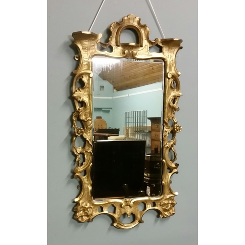 31 - A FINELY CARVED 18TH CENTURY GILTWOOD FRAMED WALL MIRROR, this is a beautifully decorated carved wal... 