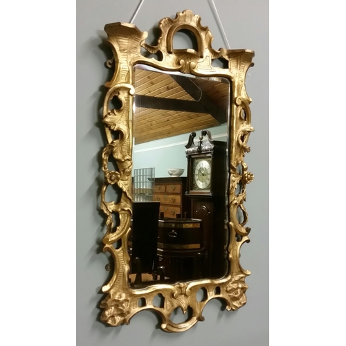 31 - A FINELY CARVED 18TH CENTURY GILTWOOD FRAMED WALL MIRROR, this is a beautifully decorated carved wal... 