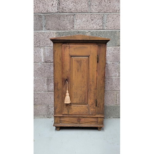 42 - A VERY CHAMING COUNTRY-STYLE / RUSTIC SINGLE DOOR CABINET, with a triangular pediment to the front, ... 