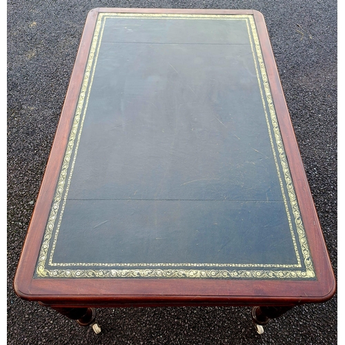 55 - A VERY GOOD QUALITY 19TH CENTURY MAHOGANY TOOLED LEATHER TOPPED WRITING DESK, the desk top with roun... 