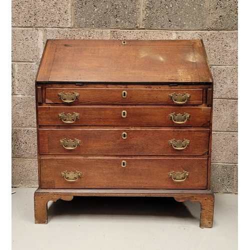 59 - AN OAK DROP FRONT SECRETAIRE DESK, four graduated drawers each with brass swing handles, raised on b... 