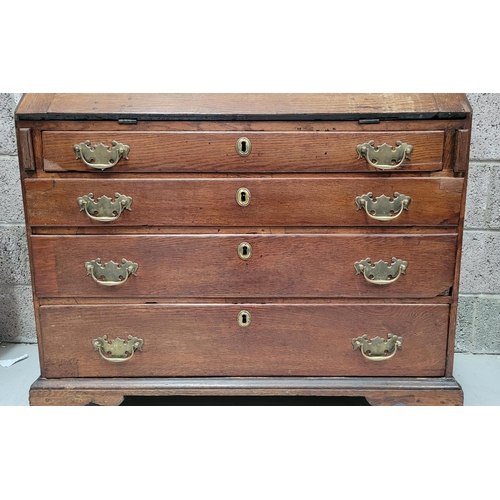 59 - AN OAK DROP FRONT SECRETAIRE DESK, four graduated drawers each with brass swing handles, raised on b... 