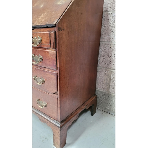 59 - AN OAK DROP FRONT SECRETAIRE DESK, four graduated drawers each with brass swing handles, raised on b... 