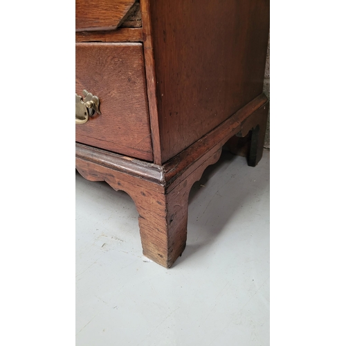 59 - AN OAK DROP FRONT SECRETAIRE DESK, four graduated drawers each with brass swing handles, raised on b... 