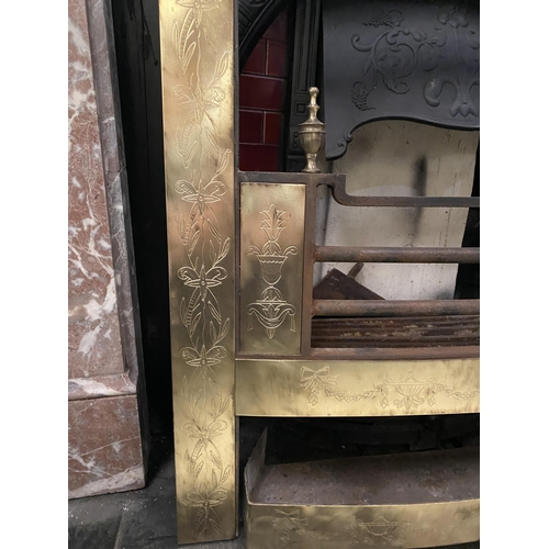 70 - AN EXCELLENT POLISHED BRASS FIRE INSERT, with decorative bow and swag designs throughout, finials to... 