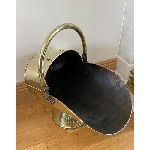 72 - A GOOD QUALITY POLISHED BRASS VICTORIAN HELMET SHAPED COAL SCUTTLE, with a curved handle to the top ... 