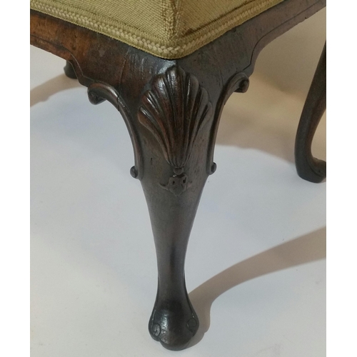 88 - AN IRISH 19TH CENTURY WALNUT STOOL, with stuffed over upholstered seat, raised on a shaped apron wit... 