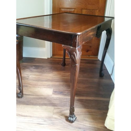 89 - AN IRISH 18TH CENTURY MAHOGANY SILVER-TABLE, with a dished top over an apron adorned with a carved c... 