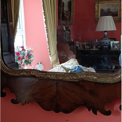 90 - A VERY GOOD EARLY GEORGIAN IRISH WALNUT & GILT WALL MIRROR, the walnut pierced frame with scrolling ... 