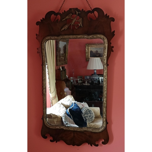 90 - A VERY GOOD EARLY GEORGIAN IRISH WALNUT & GILT WALL MIRROR, the walnut pierced frame with scrolling ... 