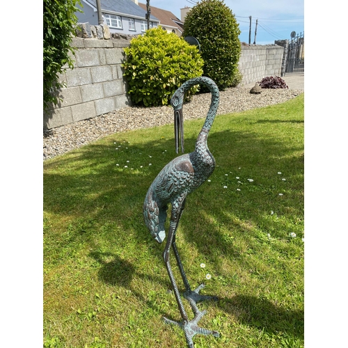 93 - A GOOD QUALITY PAIR OF GARDEN ORNAMENTS IN THE FORM OF STANDING HERON BIRDS, one standing tall, the ... 