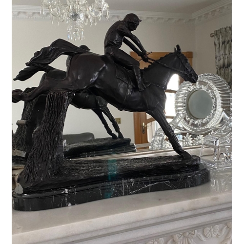 95 - A GREAT PAIR OF MANTEL ORNAMENTS IN THE FORM OF RACE HORSES WITH JOCKEYS, each of the horses set in ... 