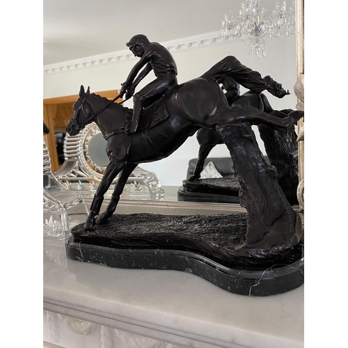 95 - A GREAT PAIR OF MANTEL ORNAMENTS IN THE FORM OF RACE HORSES WITH JOCKEYS, each of the horses set in ... 