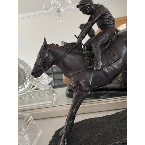 95 - A GREAT PAIR OF MANTEL ORNAMENTS IN THE FORM OF RACE HORSES WITH JOCKEYS, each of the horses set in ... 