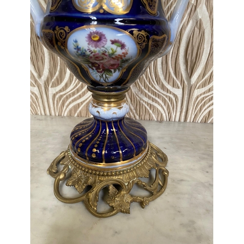 99 - A BEAUTIFUL PAIR OF SEVRES STYLE PORCELAIN & BRASS OIL LAMPS, each with a cobalt blue & gilt coloure... 