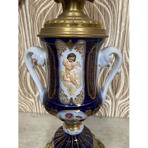 99 - A BEAUTIFUL PAIR OF SEVRES STYLE PORCELAIN & BRASS OIL LAMPS, each with a cobalt blue & gilt coloure... 