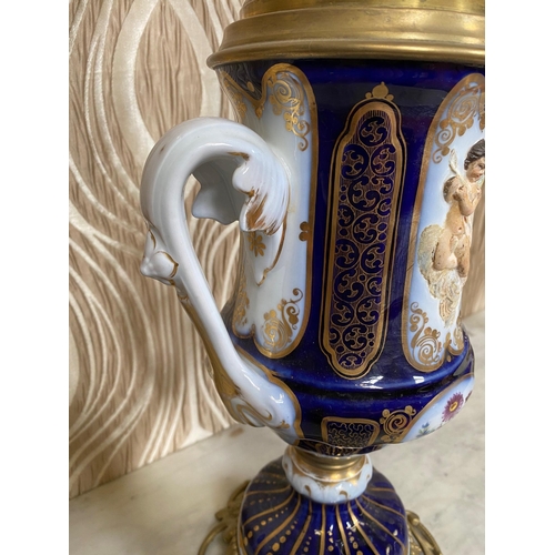 99 - A BEAUTIFUL PAIR OF SEVRES STYLE PORCELAIN & BRASS OIL LAMPS, each with a cobalt blue & gilt coloure... 