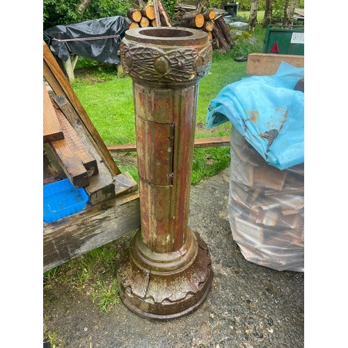 229 - AN ANTIQUE PAIR OF CAST IRON GARDEN LAMPS, each with double head fitting, the graduated column comes... 