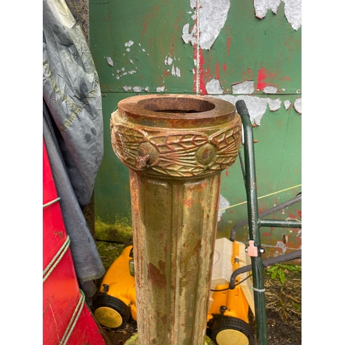 229 - AN ANTIQUE PAIR OF CAST IRON GARDEN LAMPS, each with double head fitting, the graduated column comes... 