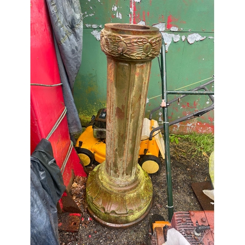 229 - AN ANTIQUE PAIR OF CAST IRON GARDEN LAMPS, each with double head fitting, the graduated column comes... 