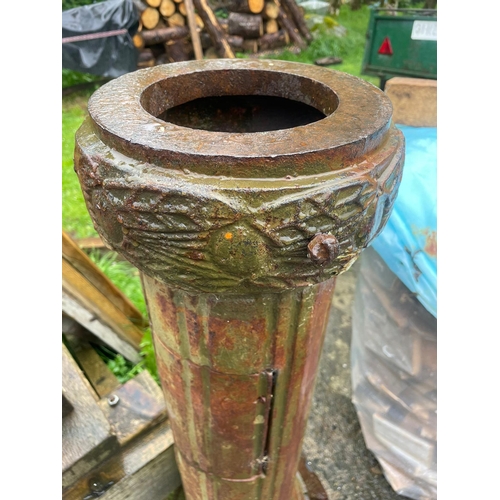 229 - AN ANTIQUE PAIR OF CAST IRON GARDEN LAMPS, each with double head fitting, the graduated column comes... 