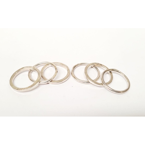 A SET OF SIX STERLING SILVER WRIGHT & TEAGUE ‘GALA’ STACKING RINGS