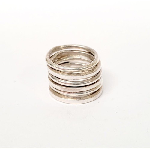 A SET OF SIX STERLING SILVER WRIGHT & TEAGUE ‘GALA’ STACKING RINGS