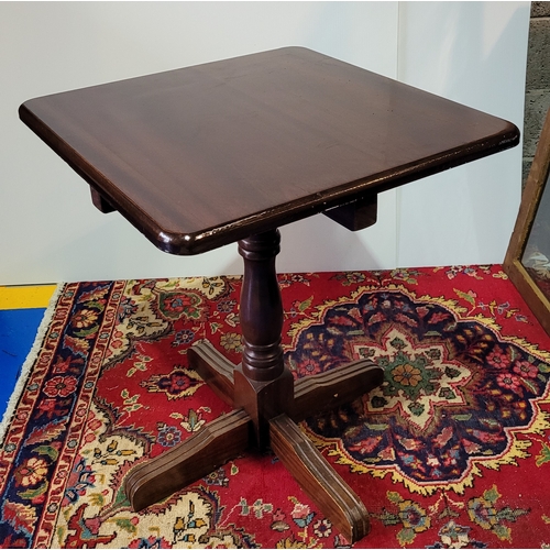 99 - A SQUARE SHAPED ‘PUB TABLE’, with rounded corners, raised on turned wooden column support and termin... 