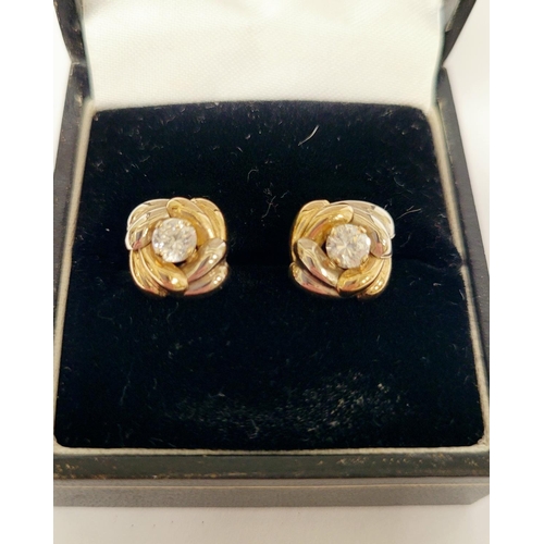 128 - A PAIR OF 9CT DUAL TONED GOLD STUD EARRINGS, with a central solitaire clear gemstone setting, marked... 