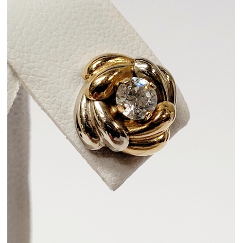 128 - A PAIR OF 9CT DUAL TONED GOLD STUD EARRINGS, with a central solitaire clear gemstone setting, marked... 