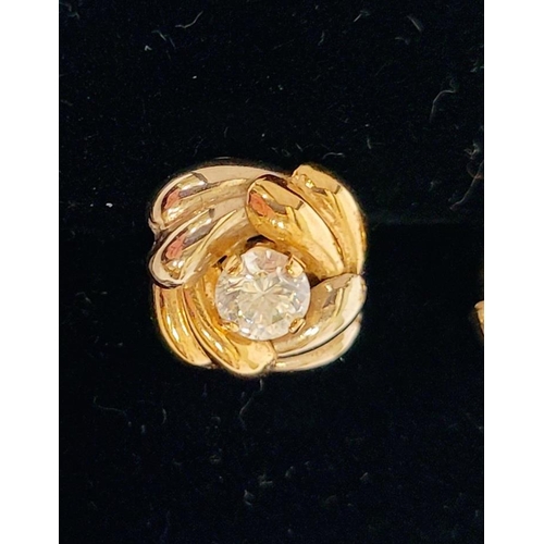 128 - A PAIR OF 9CT DUAL TONED GOLD STUD EARRINGS, with a central solitaire clear gemstone setting, marked... 